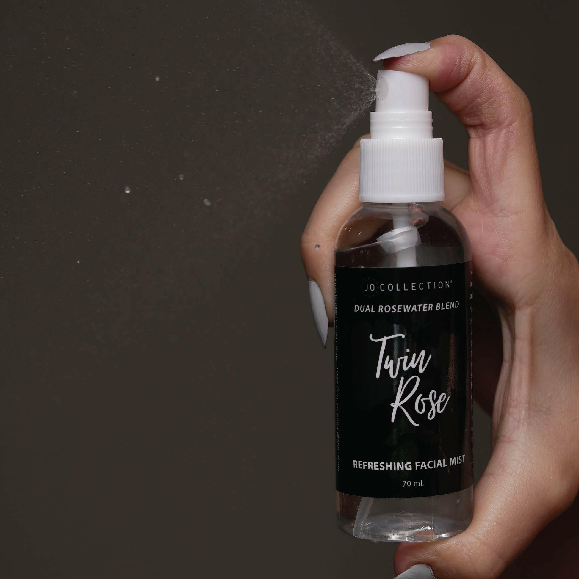 spraying the Twin Rose facial mist