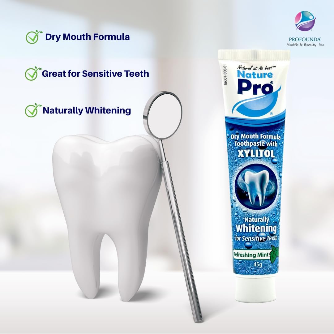 Nature Pro toothpaste tube with a tooth model and mirror on a white background