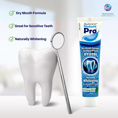 Nature Pro toothpaste tube with a tooth model and mirror on a white background