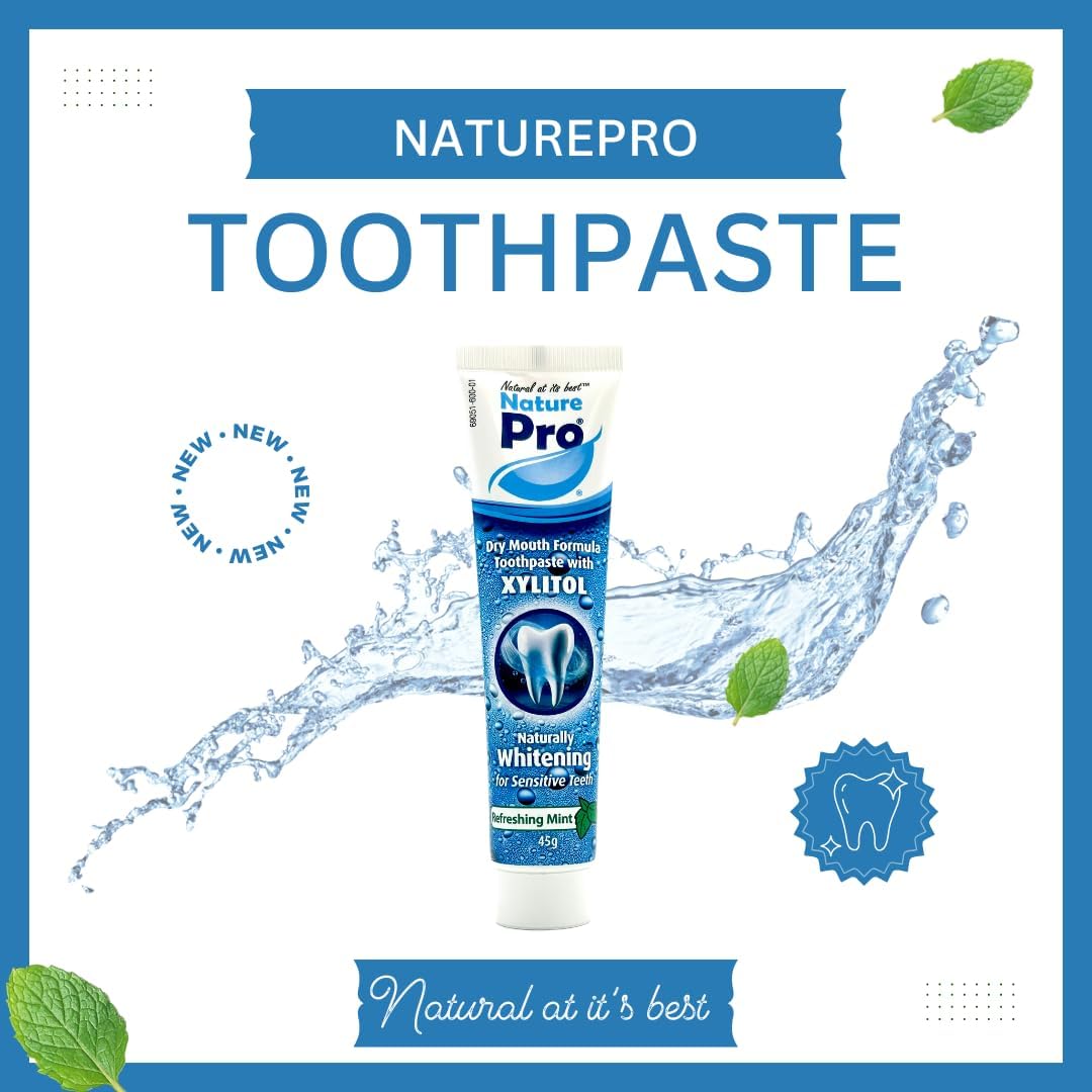 NaturePro toothpaste tube with water splash and mint leaves on a white background