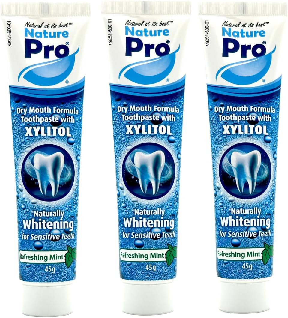 Three tubes of Nature Pro Dry Mouth Formula Toothpaste with Xylitol on a white background