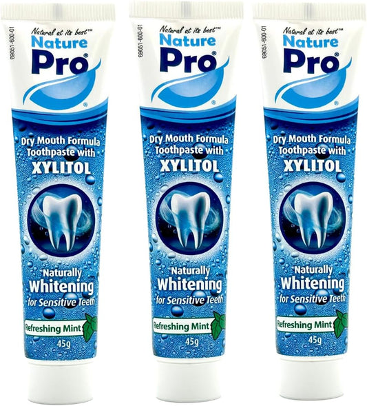 Three tubes of Nature Pro Dry Mouth Formula Toothpaste with Xylitol on a white background