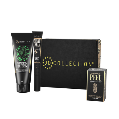 A collection of skincare products from Jo Collection, including a facial cleanser, night cream, and pineapple peel product, packaged in a black box.