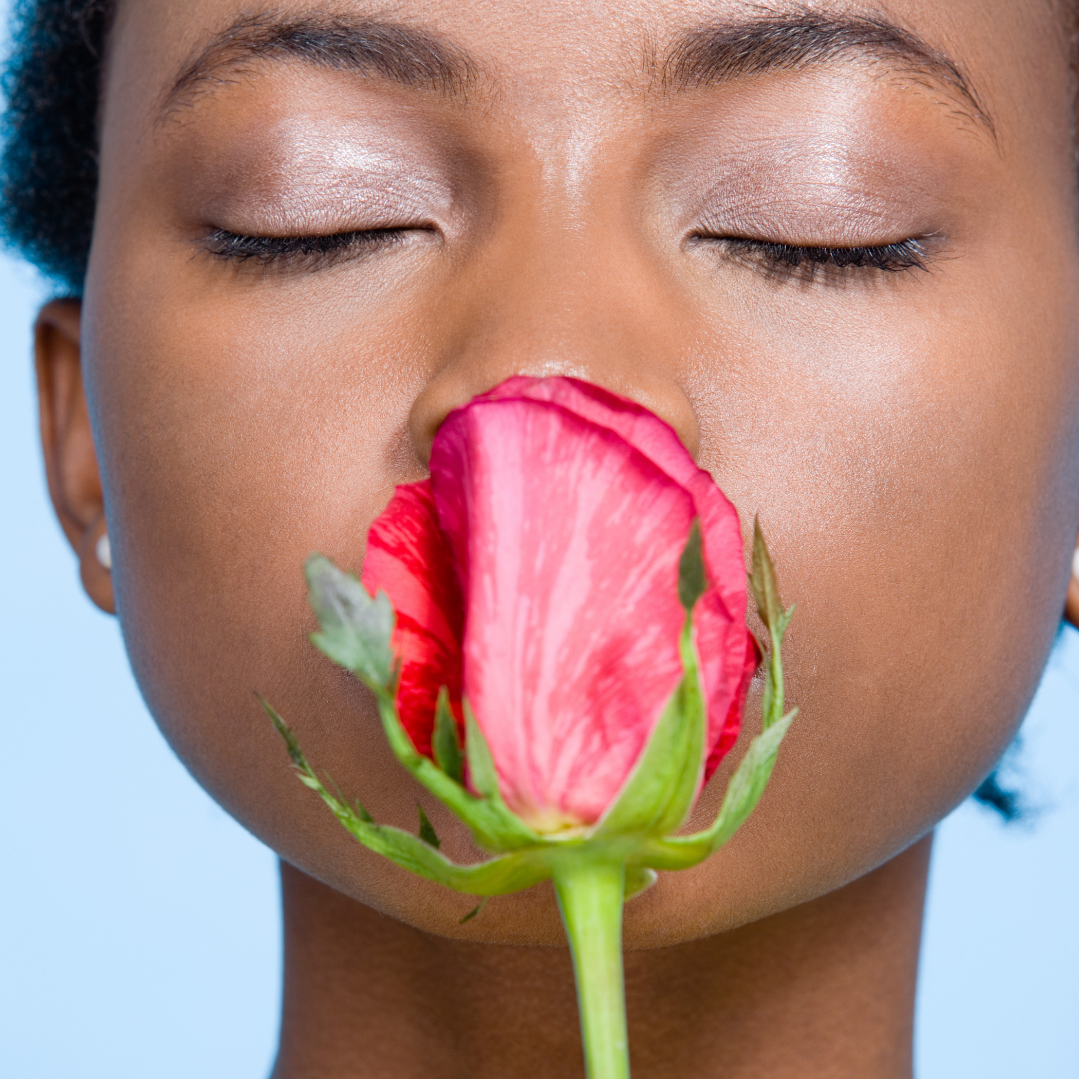 Woman smelling a flower
