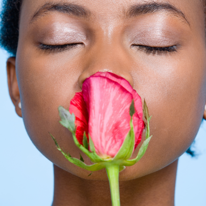 Woman smelling a flower